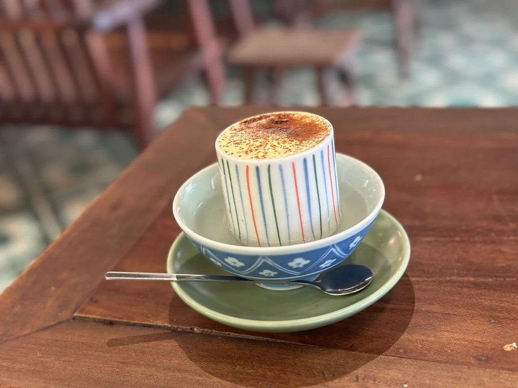 Egg coffee is kept warm in a bowl of hot water, this rich and silky drink stays perfectly smooth